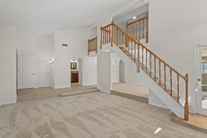 Formal Living Room with vaulted ceiling and plenty of light