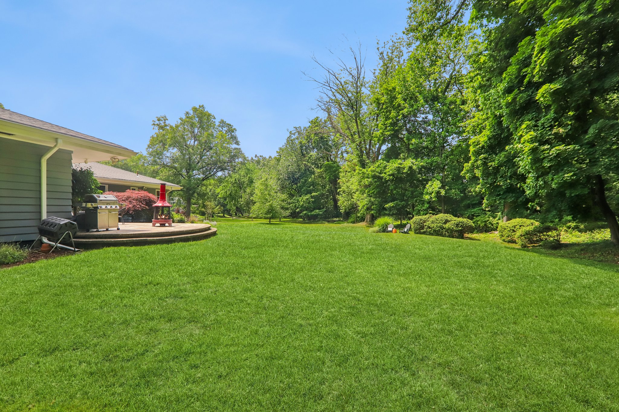 A charming extension of Yantacaw Brook Park meanders along Yantacaw Brook Road, providing a surprising expanse of greenery between the home and the park's main entrance just one block away.