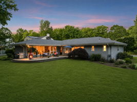 As dusk settles over the park, the property takes on an entirely different character. The lights begin to glow, the trees soften into silhouette, and the patio becomes one of the most enchanting places to spend an evening in Upper Montclair.