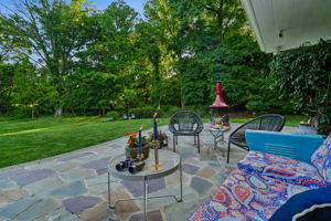 Most backyards end at a fence line. Here, the landscape unfolds beyond a true mid-century gem.