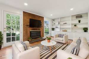 Family Room w/ built-ins, open to rear yard