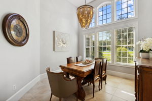 The dining area is impressive with 14 foot ceilings, a wall of windows ...