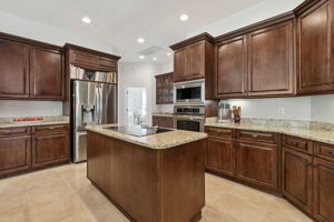 ...has mahogany 46-inch cabinets with crown molding and bottom trim...