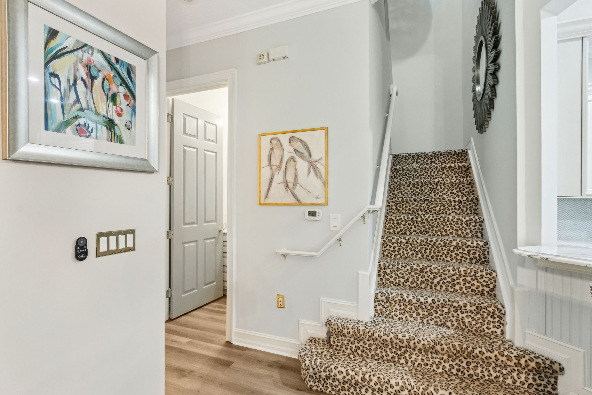 Bold yet balanced—the animal-print staircase infuses personality into the home’s design without going over the top.