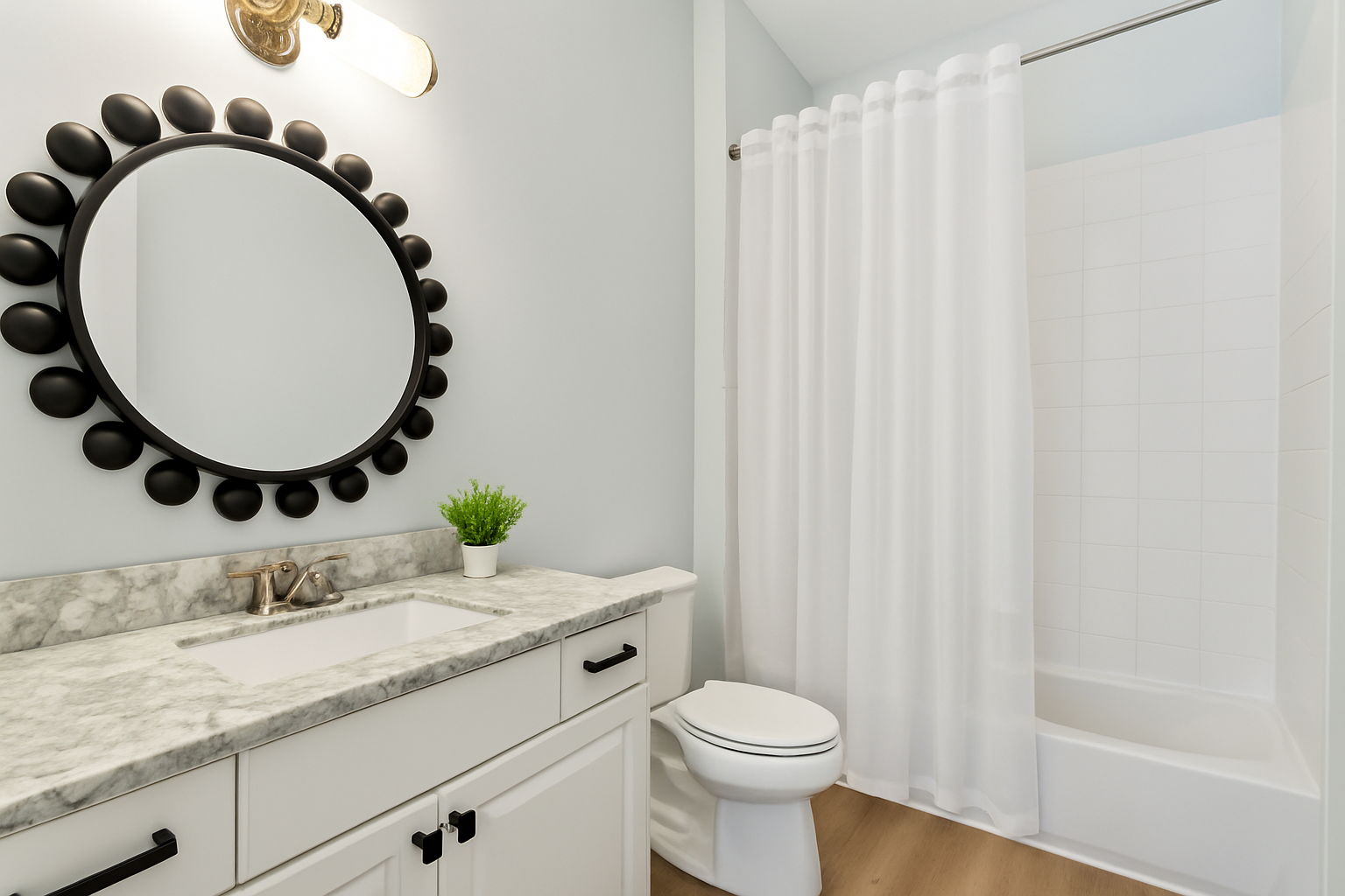 The home’s high-design aesthetic carries gracefully into both guest baths.