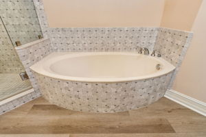 ... or refresh in the adjoining shower, equally clad in the same luxurious stone for a harmonious look.