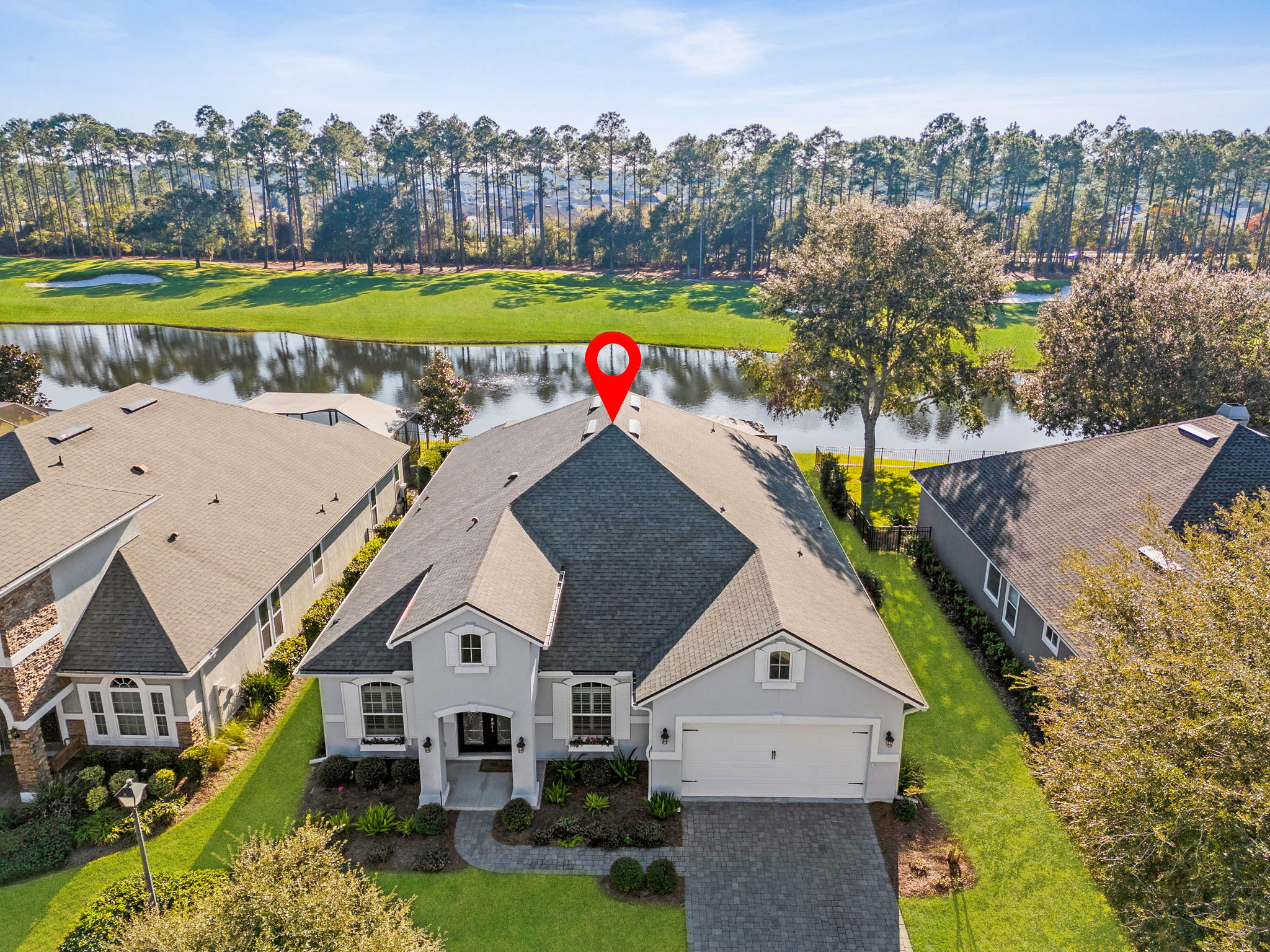 Optimally situated on a .33 acre lot with premium water and golf course views.