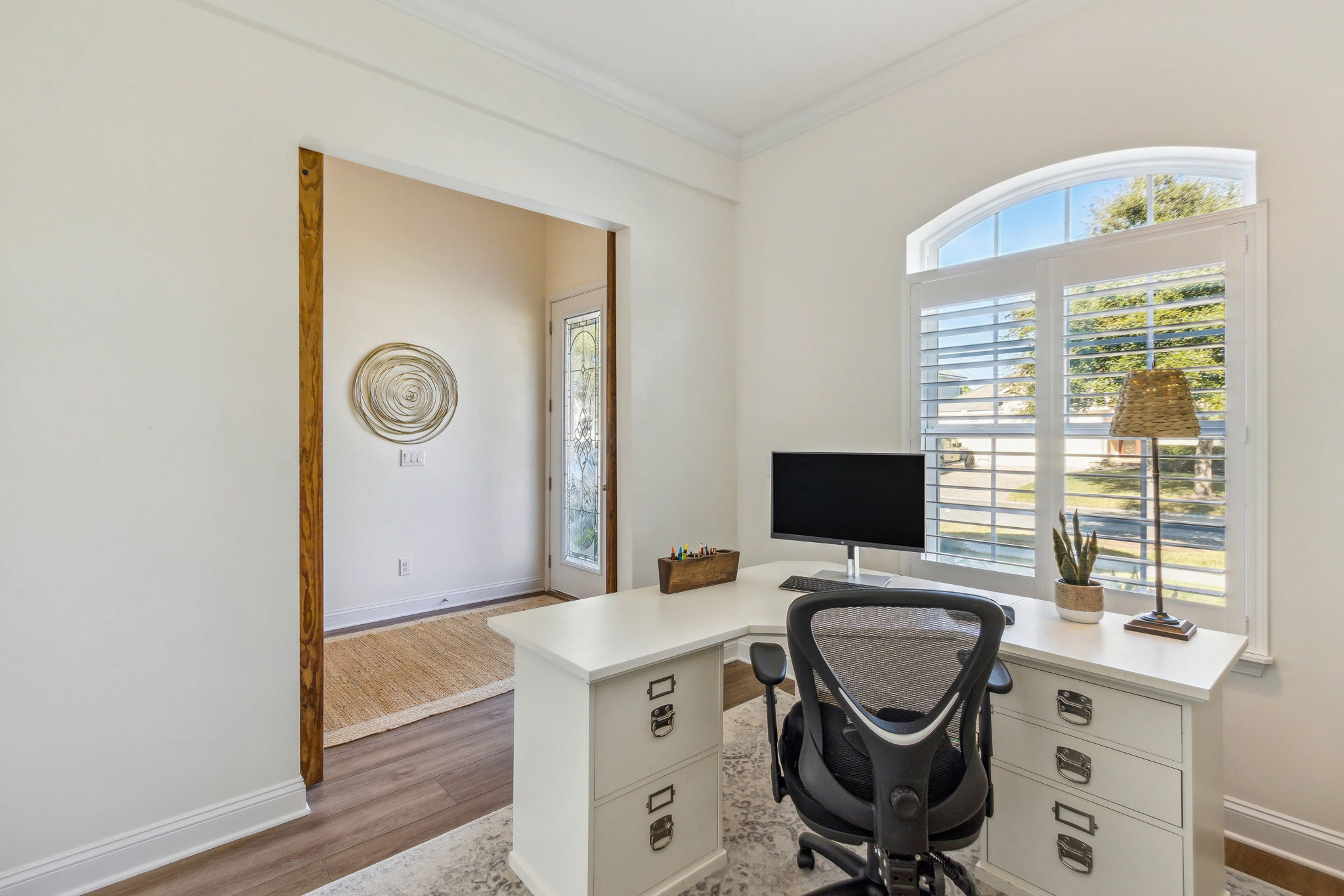 The first office is delightfully accented by a custom barn door entrance.