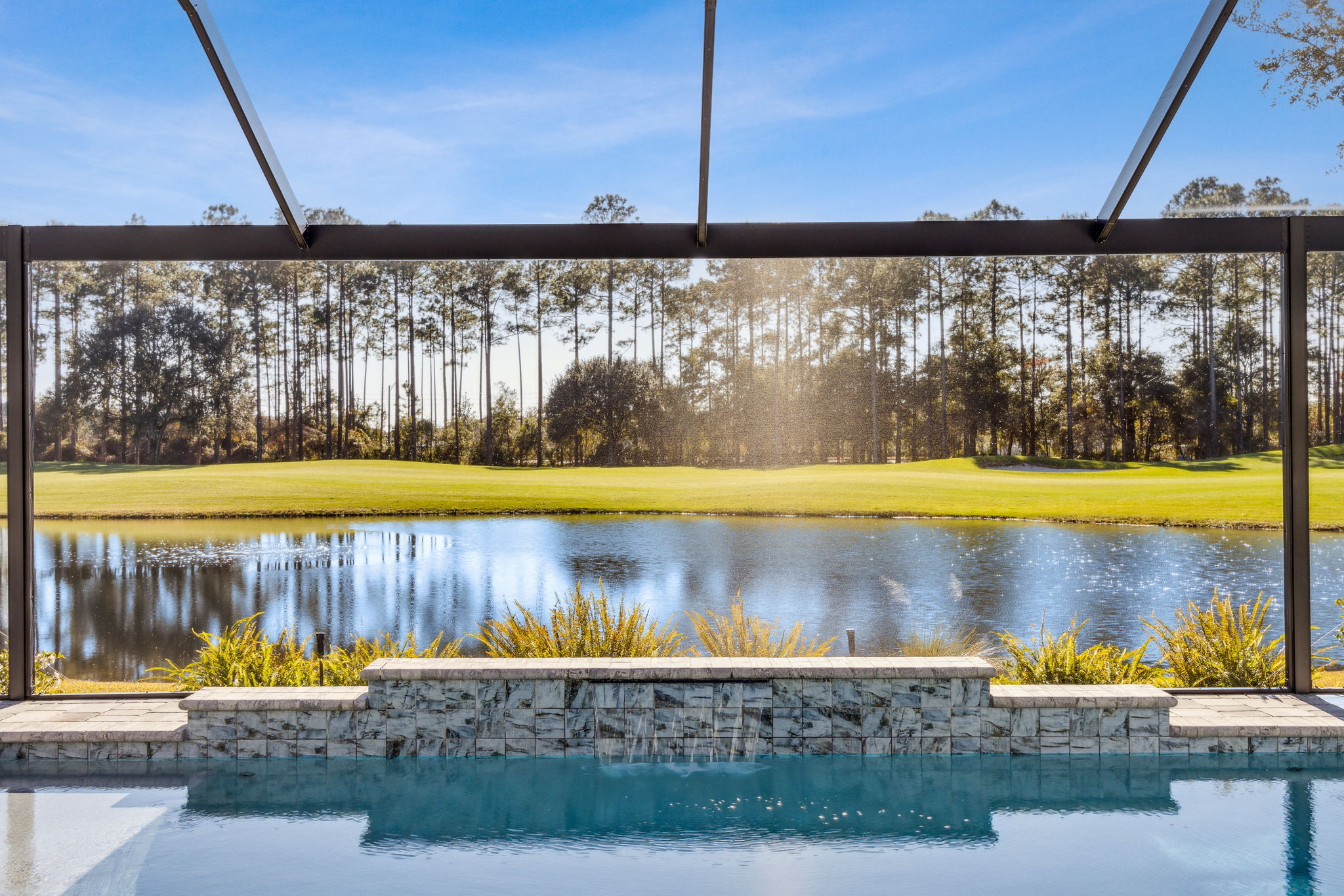 ...designed to create the illusion that the pool extends directly into the natural water beyond.