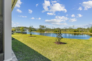 Enjoy serene backyard living with stunning pond views.
