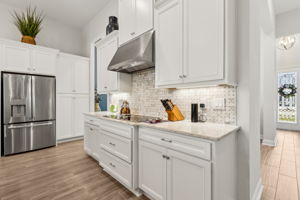 White soft close cabinets add a clean