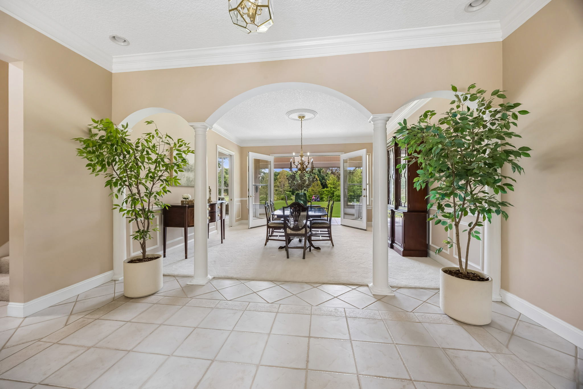 From the foyer, graceful arches frame the view ahead…