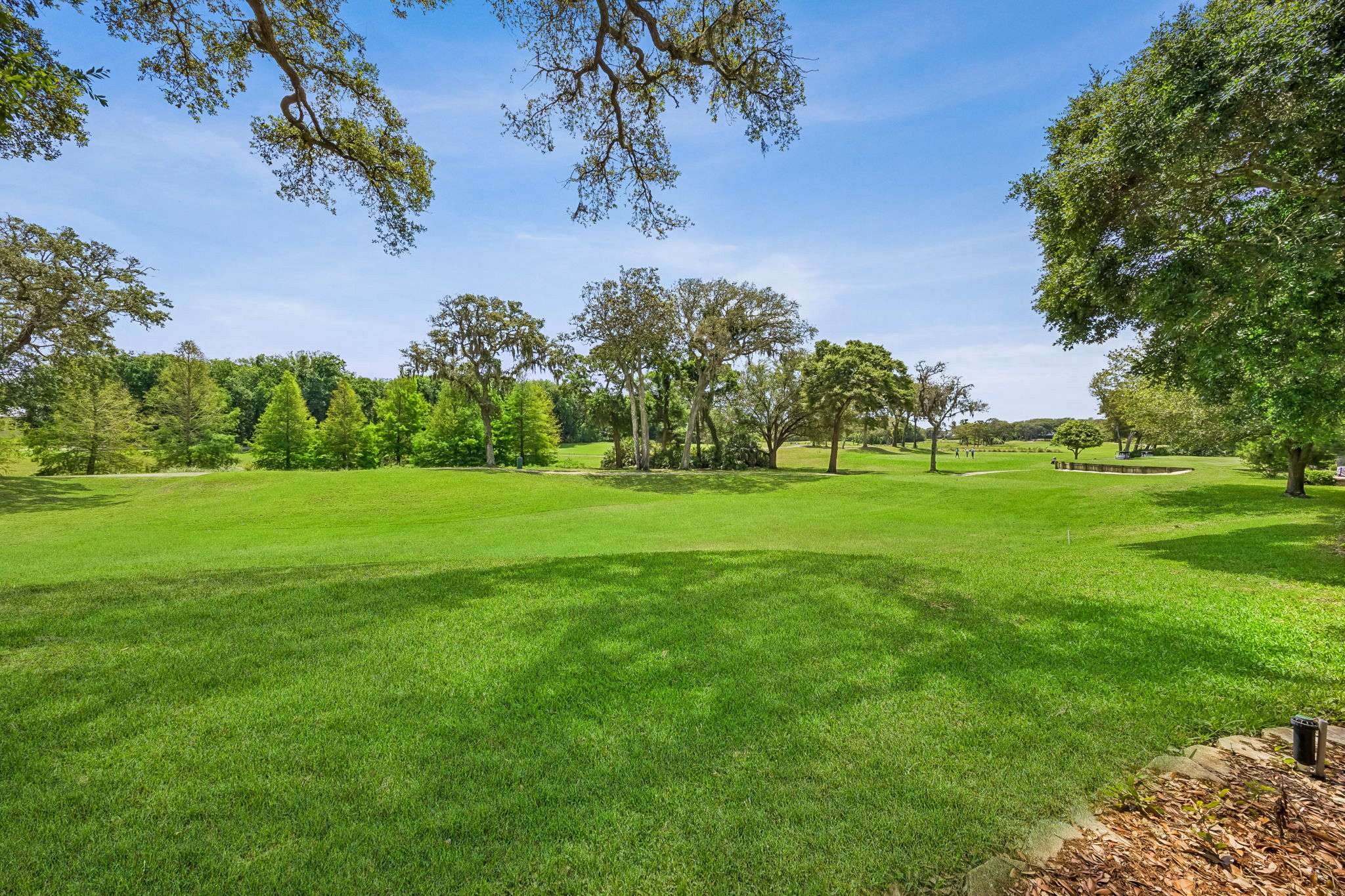 Wide fairway frontage gives the home a rare sense of openness, privacy, and green space...
