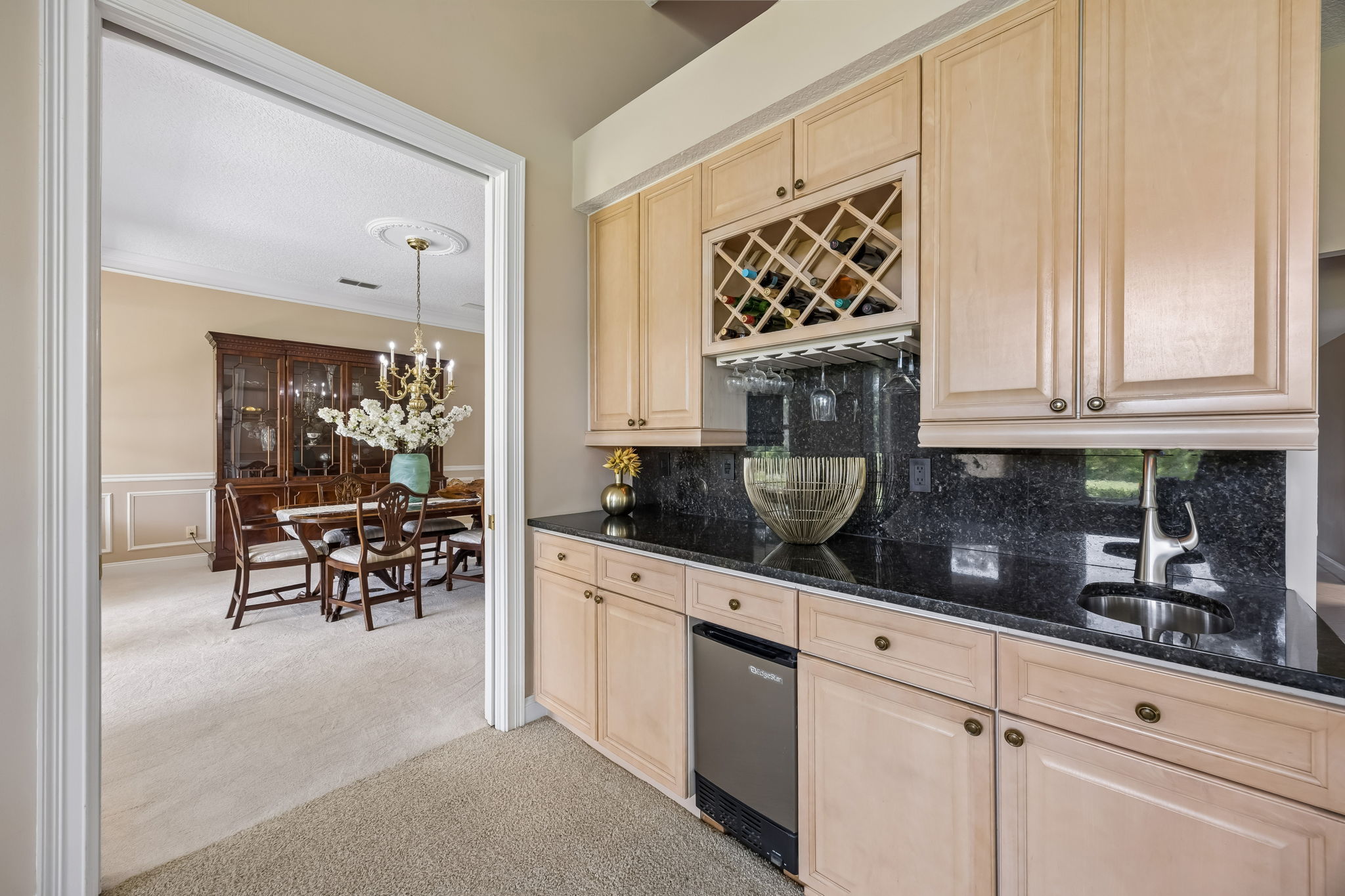 A built-in bar adds another layer of function — perfect for serving, storage, and effortless hosting.