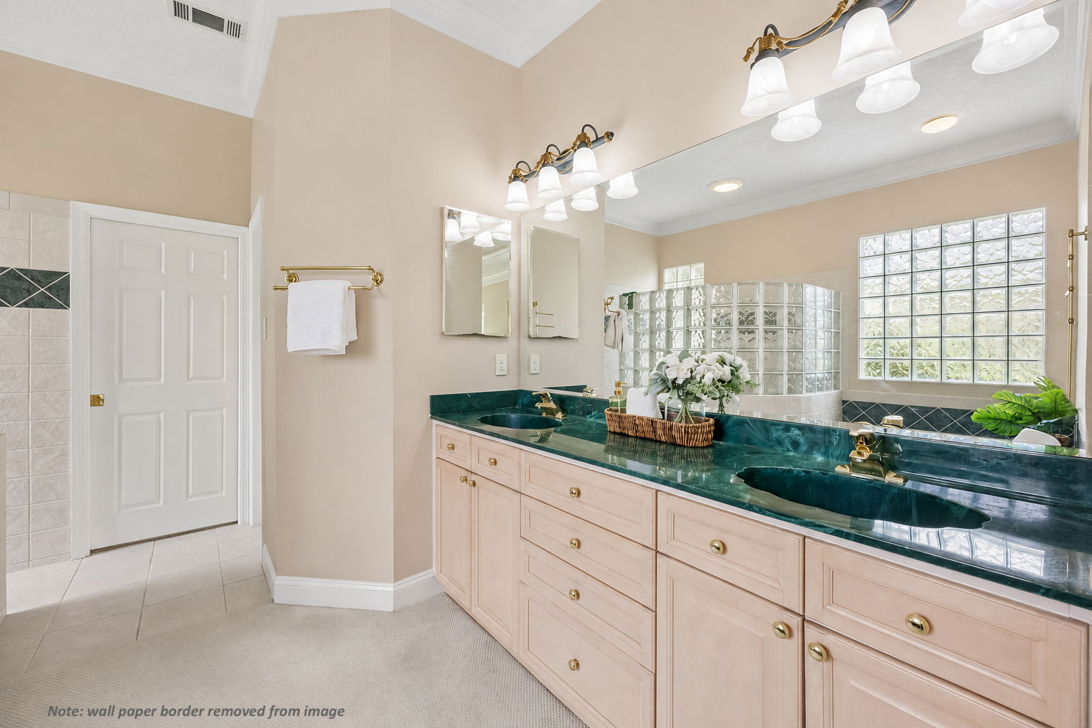 Dual vanities provide space and function, with the bath designed to support relaxed daily routines.
