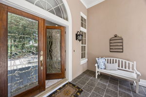 The covered entry sets a quieter tone — gracious, sheltered, and thoughtfully designed.