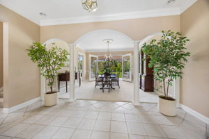 From the foyer, graceful arches frame the view ahead…