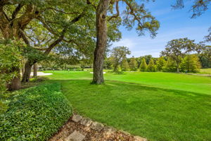 …with mature oaks and layered landscaping framing the view in quiet, natural beauty.