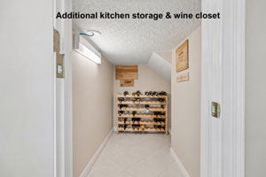 Additional kitchen storage and a dedicated wine closet add the kind of practical space every home should have.