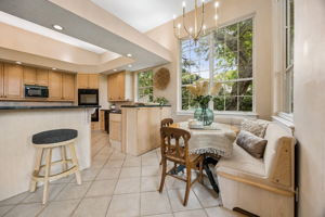 Morning light, fairway views, and an easy connection to the kitchen create a breakfast space that feels calm, useful, and beautifully placed.