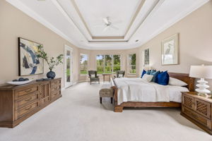 The spacious bedroom flows directly into the primary bath, keeping the suite private, practical, and easy to live in.