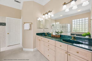 Dual vanities provide space and function, with the bath designed to support relaxed daily routines.