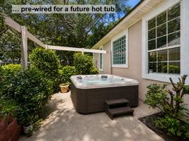 …pre-wired for a future hot tub and framed by landscaping for added privacy.