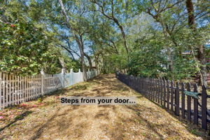 Steps from your door, a wooded pathway begins the easy journey toward the beach…