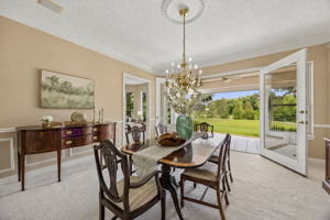 Or keep it as a formal dining room, where wide openings draw the eye straight to the fairway beyond.