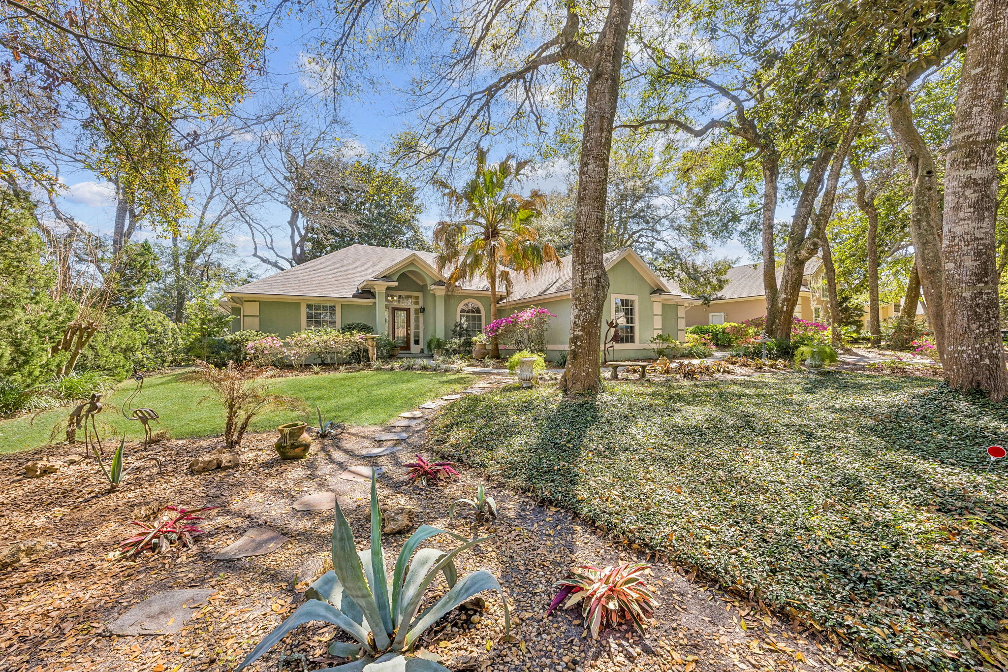 The front elevation has a warm, understated presence that feels inviting from the start.