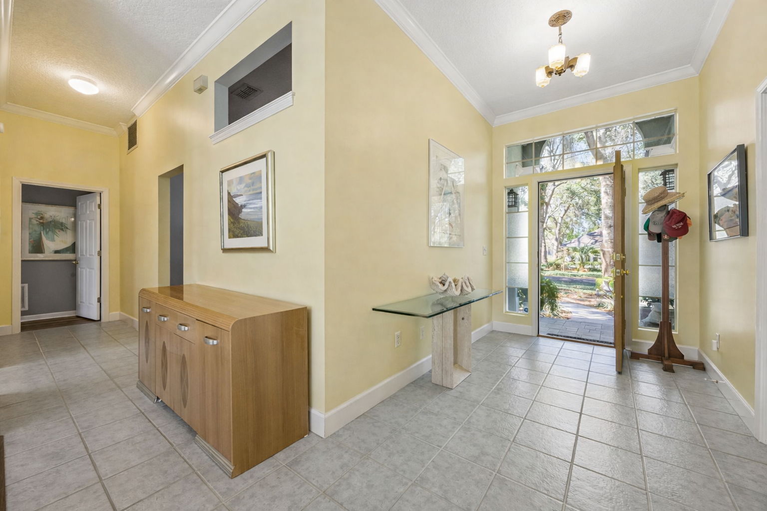 Inside, a bright foyer welcomes you with the airy, light-filled feel carried throughout the home.