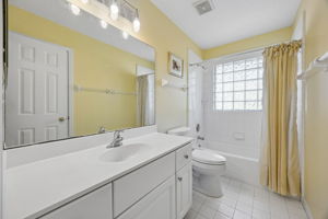 The guest bath is neatly arranged and conveniently located for everyday use.