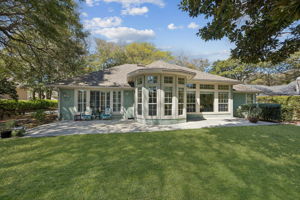 From the lawn, the home feels both open and tucked in ...