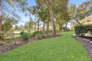 ... with mature trees and tasteful landscaping softening the golf frontage.