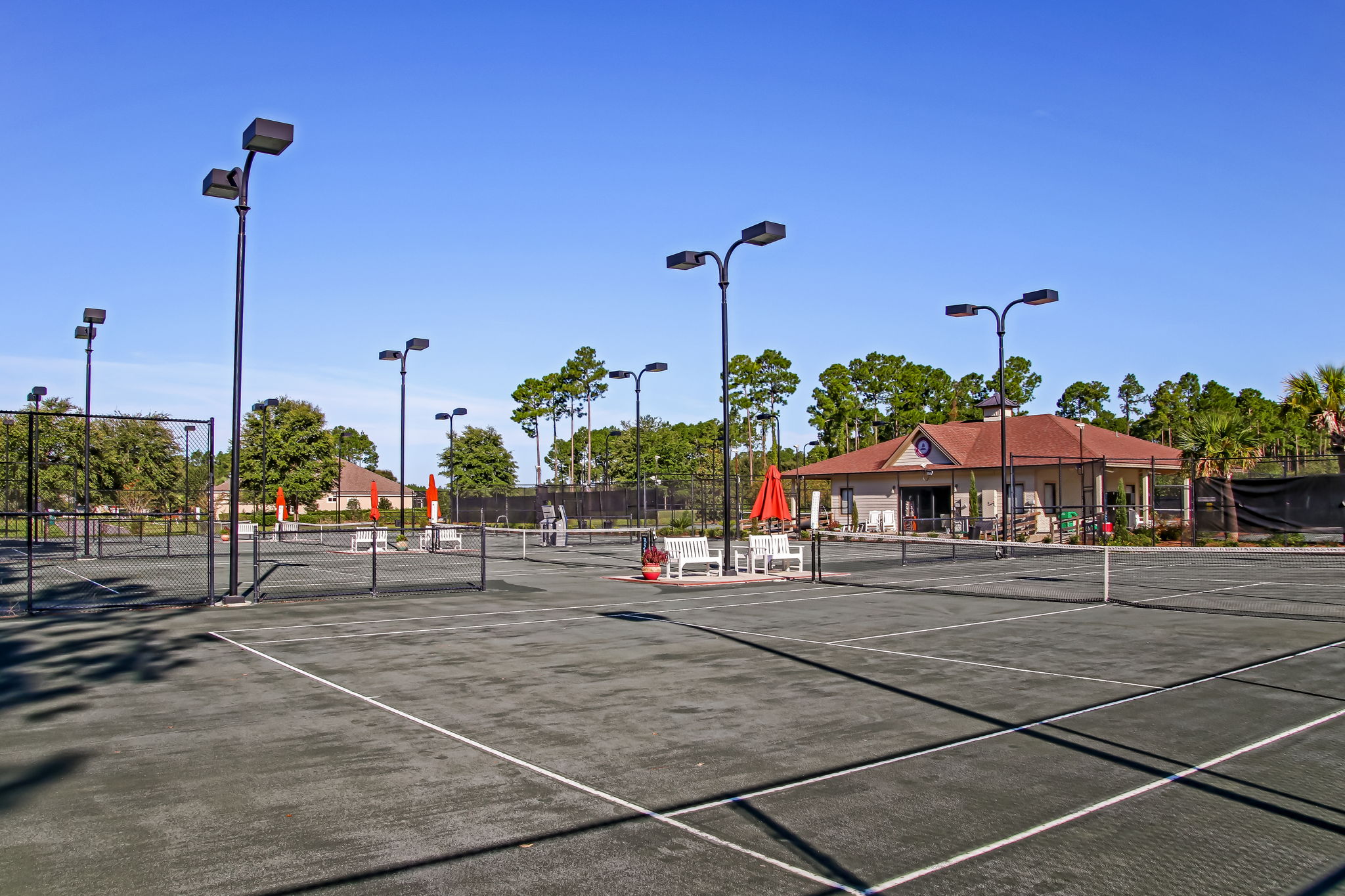 Tennis is played on HAR-TRU championship-quality courts ...