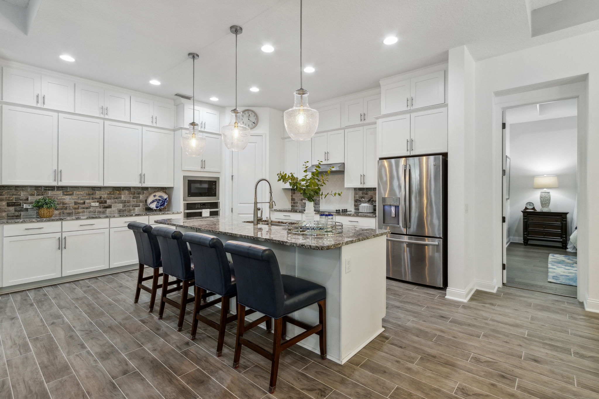 The kitchen is graced with premium granite counters ...