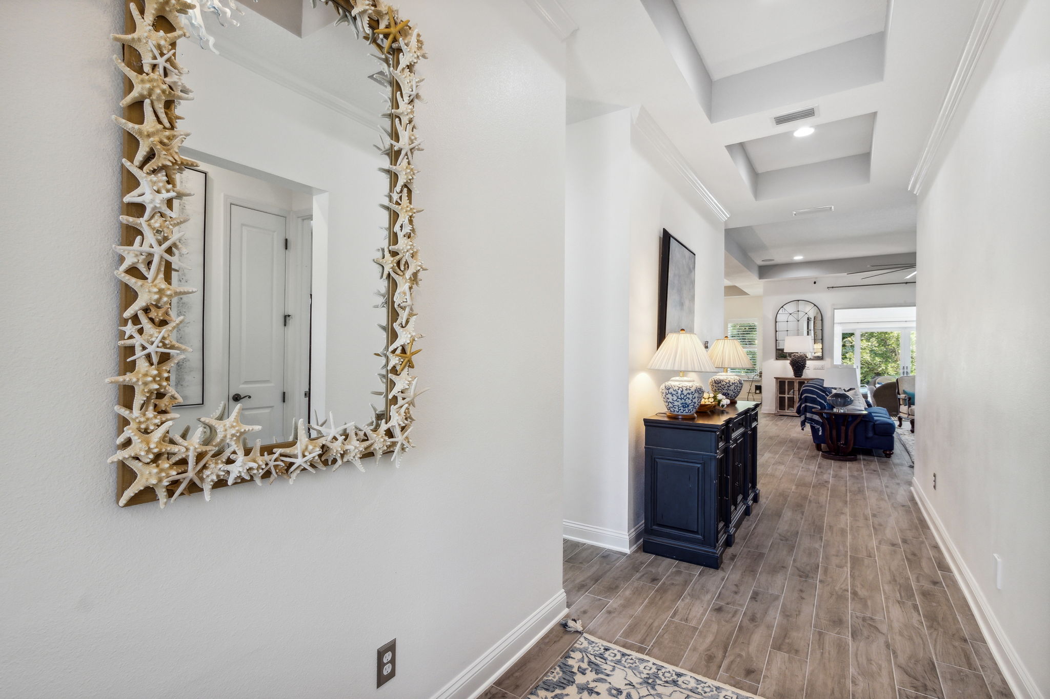 Enter through the grand foyer upgraded with coffer ceiling