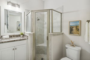 A second guest bath with tiled shower and upgraded vanity