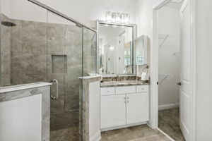 The master bath with upgraded seamless glass shower