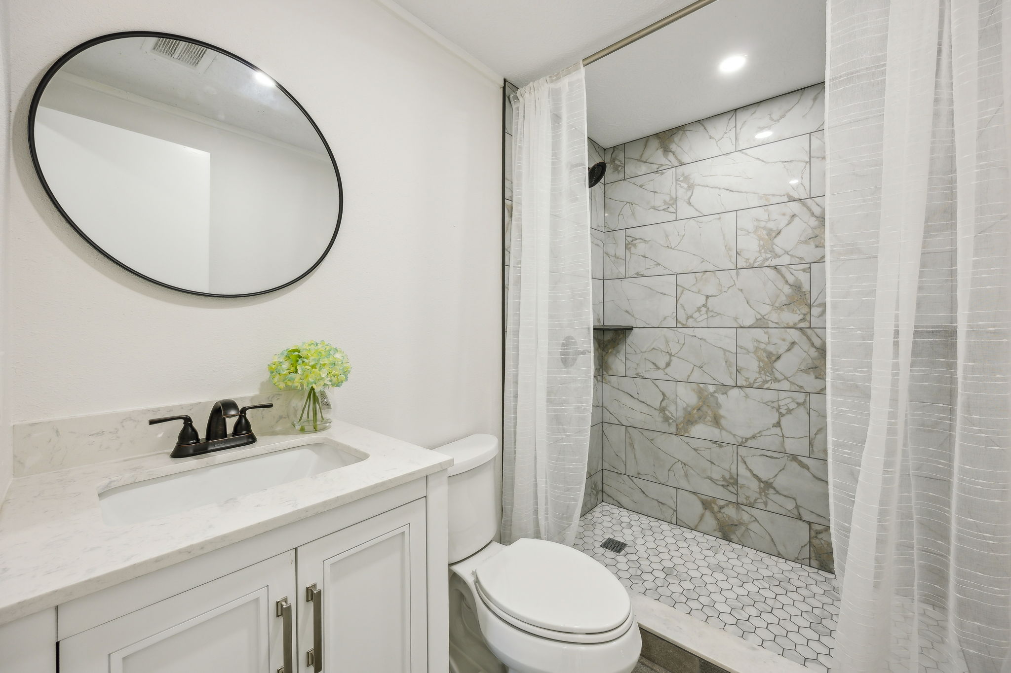 The guest bath is also completely renovated ...