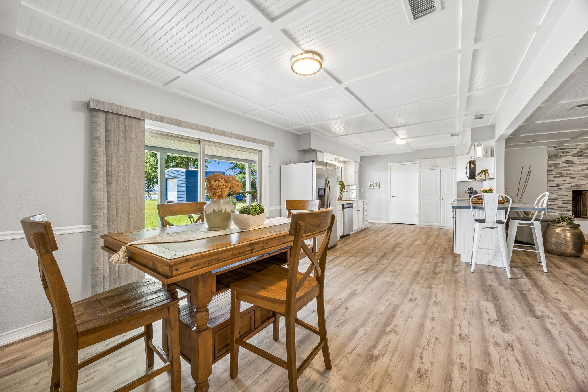 … while its open connection to the kitchen keeps meals and conversation flowing easily.