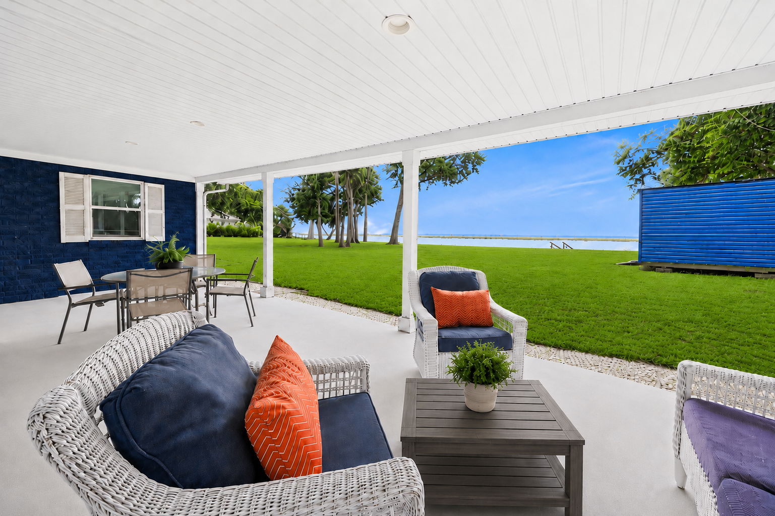 An expansive covered patio creates a great place to relax, dine and enjoy the river views...