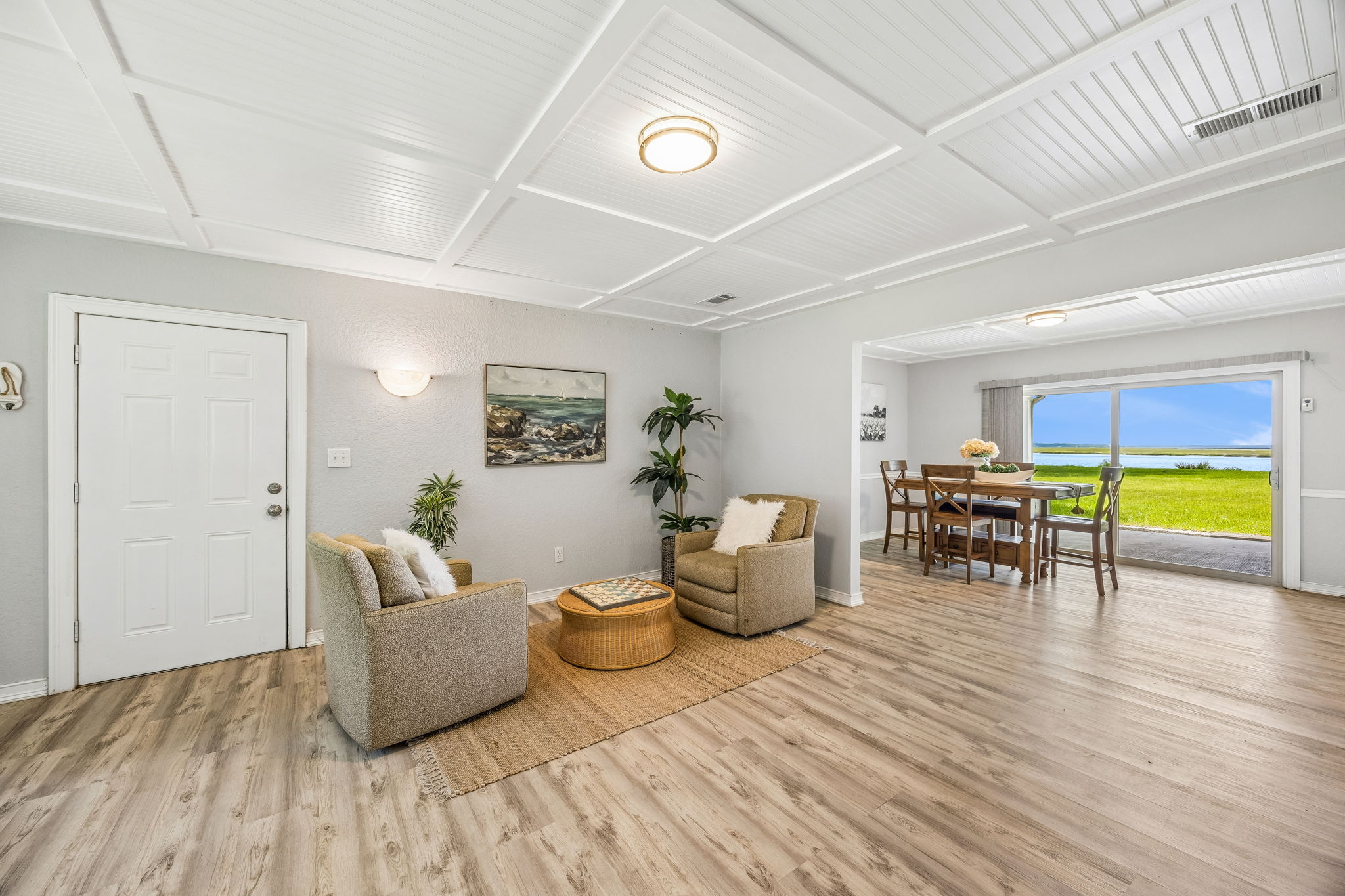 Inside, the open living spaces feel comfortable and casual, with the water always part of the view...