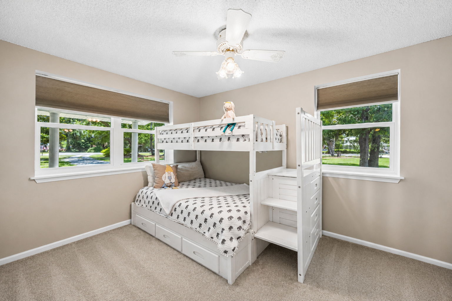 The second bedroom is bright and comfortable, with windows on two sides bringing in plenty of natural light...