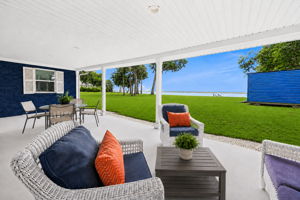 An expansive covered patio creates a great place to relax, dine and enjoy the river views...