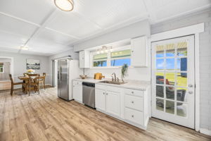 The bright kitchen keeps the river in view while offering plenty of storage and workspace...