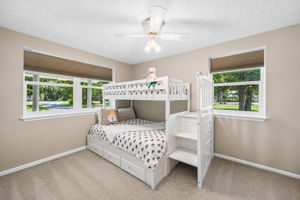 The second bedroom is bright and comfortable, with windows on two sides bringing in plenty of natural light...