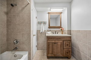 ...and the guest bath offers a full tub/shower combination and neutral finishes.