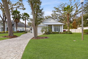 The home features lushly landscaped yard and paver hardscapes ...