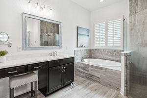 This generous master bath boasts dual vanities ...